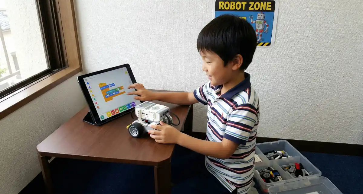 Student building a robot